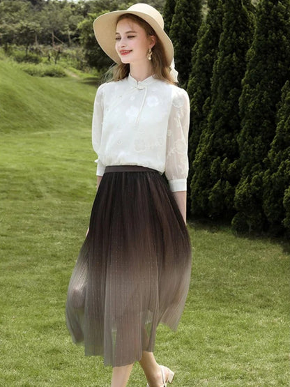 A woman wearing an ombre color tule midi skirt.