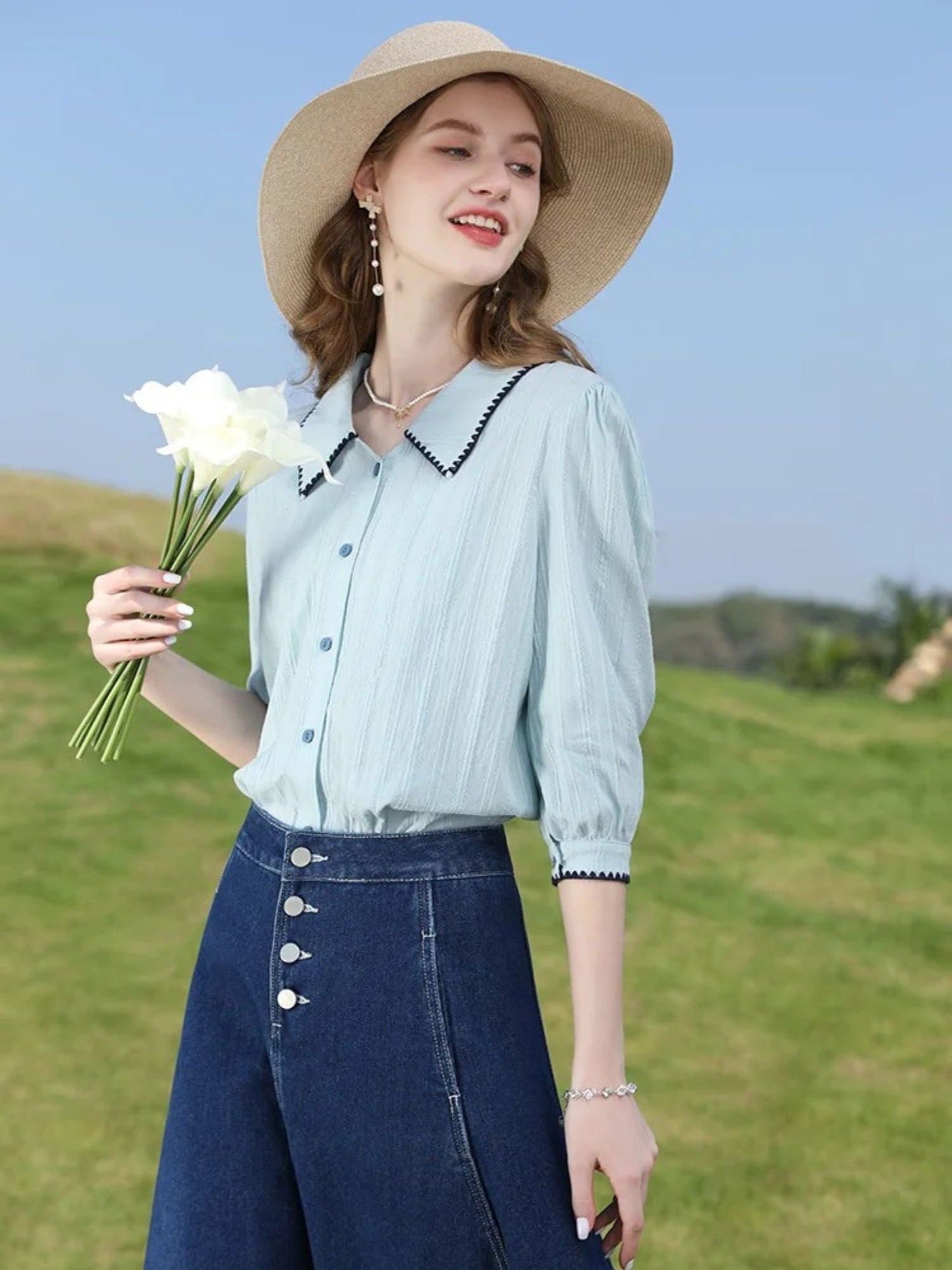 A woman wearing a vintage high waisted denim midi skirt.