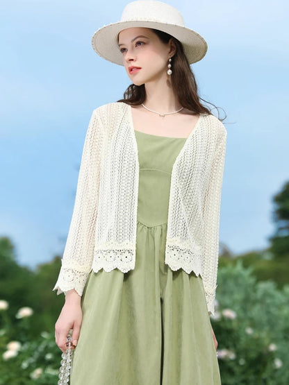 A woman wearing a lightweight eyelet cardigan